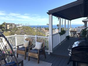 a deck with chairs and a view of the ocean at Casa Pacifica in San Pedro
