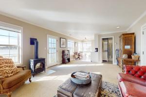 a living room with a couch and a fireplace at Bayside Cottage in Bodega Bay