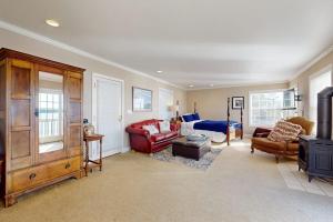 a large room with a bedroom with a bed and a couch at Bayside Cottage in Bodega Bay +21 photos