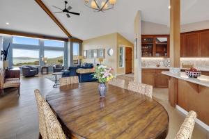 a kitchen and living room with a wooden table at Eagle's Nest in Bodega Bay