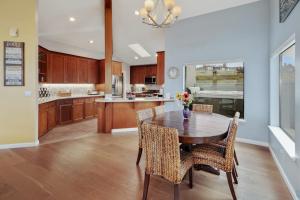 a large kitchen with a wooden table and chairs at Eagle's Nest in Bodega Bay +25 photos