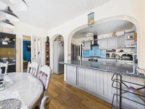 a large kitchen with a table and a dining room at Lake District Gate in Lancaster