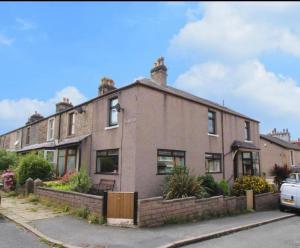a large brick house on the side of a street at Lake District Gate in Lancaster