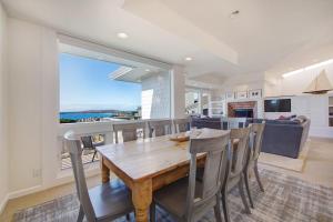 a kitchen and dining room with a table and chairs at Harbour House in Bodega Bay