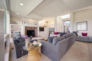a living room with two couches and a fireplace at Harbour House in Bodega Bay