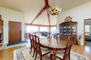 a dining room with a table and chairs at Pinnacle Heights in Bodega Bay +17 photos