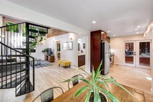 a living room with a dining table and a staircase at Canyon House in Guerneville