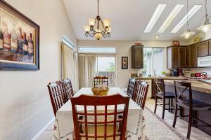 a kitchen and dining room with a table and chairs at The Grape Escape in Santa Rosa