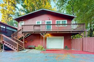 a red house with a deck and a garage at Villa Eileen in Guerneville