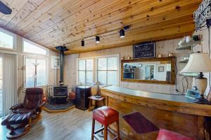 a living room with a bar in a house at Villa Eileen in Guerneville +20 photos