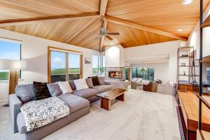 a living room with a couch and a fireplace at Latitude 38 in Bodega Bay