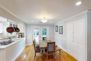 a kitchen with a table and chairs and a stove at James House in Santa Rosa +19 photos