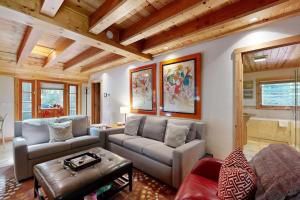 a living room with a couch and a table at Monte Rio Dream in Monte Rio +16 photos