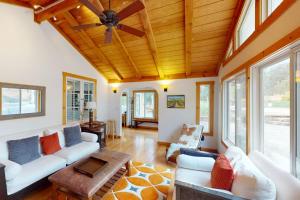 a living room with couches and a ceiling fan at Warm Springs Paradise in Glen Ellen +35 photos