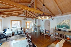 a dining room and living room with a table and chairs at Warm Springs Paradise in Glen Ellen