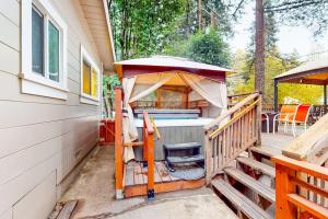 a gazebo on the side of a house at River Paradise in Guerneville