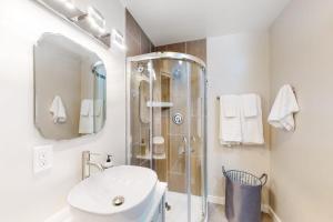 a bathroom with a shower and a toilet and a sink at River Paradise in Guerneville +12 photos