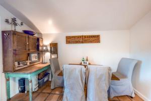 a kitchen with a table and chairs in a room at Vineyard Cottage in Guerneville