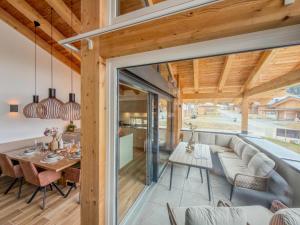 a living room with a couch and a table at Birdie Lodge in Sankt Lambrecht