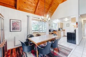 a dining room with a wooden table and chairs at Redwood Lodge in Monte Rio