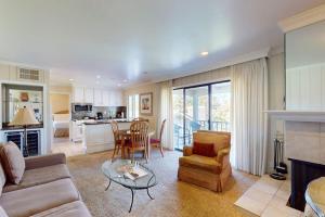 a living room with a couch and a table at Silverado Resort and Spa 266 & 267 in Napa