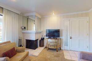a living room with a fireplace and a couch at Silverado Resort and Spa 266 & 267 in Napa +41 photos