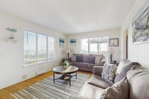 a living room with a couch and a table at Coastal Dream in Bodega Bay