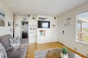 a living room with a couch and a table at Coastal Dream in Bodega Bay