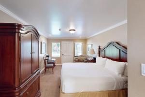 a bedroom with a large bed and a desk at Silverado Resort and Spa 287 & 288 in Napa