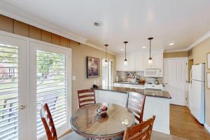 a kitchen with a table and chairs and a kitchen with white appliances at Silverado Resort and Spa 287 & 288 in Napa +31 photos