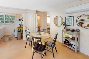 a dining room with a table and four chairs at Hidden Acres Retreat in Guerneville