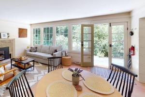a living room with a table and chairs at Hidden Acres Retreat in Guerneville