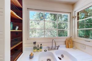 a kitchen with a sink and a window at Hidden Acres Retreat in Guerneville +15 photos