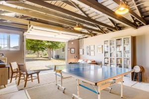 a living room with a ping pong table in it at Bird and Barrel Vineyard Farmhouse in Healdsburg