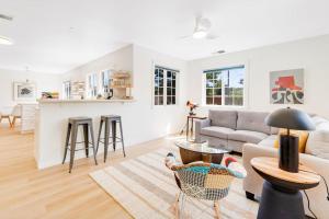 a living room with a couch and a table at Bird and Barrel Vineyard Farmhouse in Healdsburg