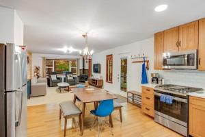 a kitchen and living room with a table and chairs at Caz Cabin 6 in Cazadero