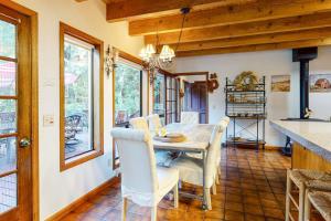 a dining room with a table and chairs at Sunrise Mountain Retreat in Cazadero