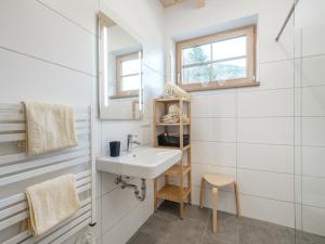a bathroom with a sink and a mirror at Haus Laura in Donnersbachwald +34 photos