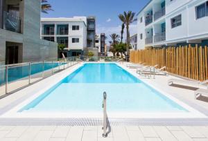 a swimming pool in the middle of a building at 51 E-scape Home in Corralejo