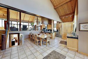 a large kitchen with a table and chairs in it at Fairview Grande in Bodega Bay +33 photos
