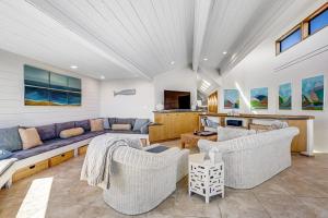 a living room with a blue couch and chairs at Blue Horizon in Bodega Bay