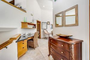 a kitchen with a wooden dresser and a table at Blue Horizon in Bodega Bay