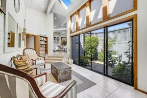 a living room with sliding glass doors and a patio at Blue Horizon in Bodega Bay +52 photos