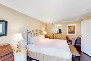 a bedroom with a large white bed in a room at Silverado Resort and Spa 382 in Napa +8 photos