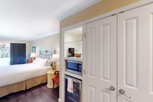 a bedroom with a bed and a large white closet at Silverado Resort and Spa 382 in Napa