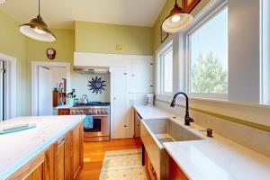 a kitchen with a sink and a large window at Magnolia Ranch Vineyards in Healdsburg