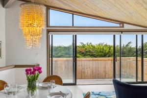 a dining room with a table and a large window at Mar Vista in Bodega Bay +40 photos