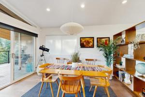 a dining room with a table and chairs at Rio Lindo River Retreat in Healdsburg