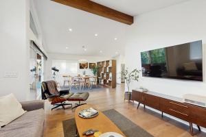 a living room with a couch and a table at Rio Lindo River Retreat in Healdsburg