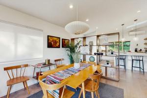 a dining room and kitchen with a table and chairs at Rio Lindo River Retreat in Healdsburg